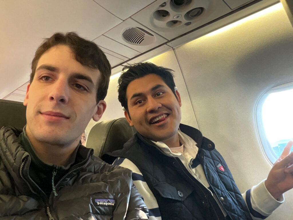 Two people seated on an airplane